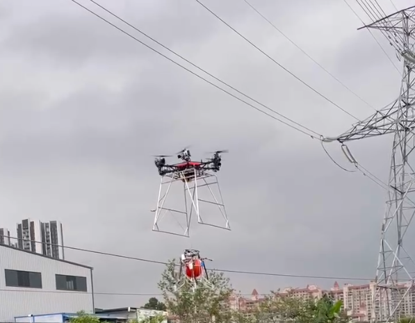 Heavy-Lift Drone Deploying Warning Marker Ball on Active Overhead Transmission Line